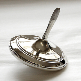 silver spinning top